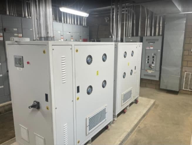 Two MPTS cabinets installed side by side in a facility electrical room